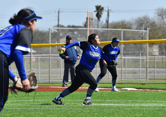 Softball pitcher throws ball.