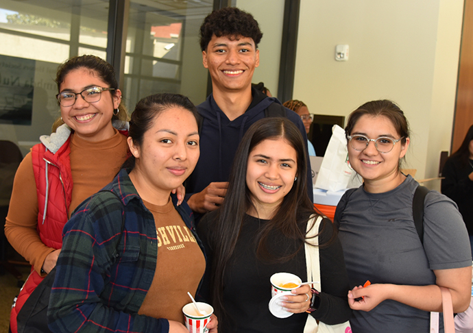 5 students stand together at Galveston College's Club and Organization fair.