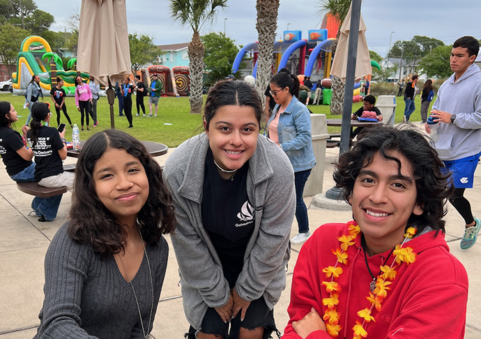 Three young people enjoying time at fest.