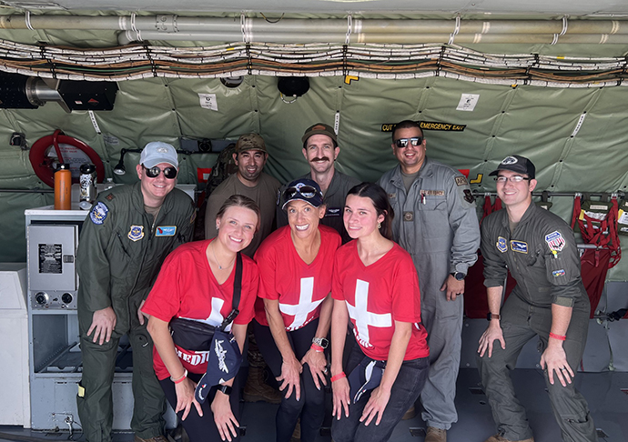 Nursing volunteers pose with pilots.