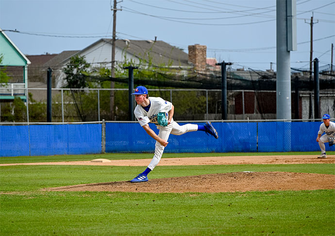 Baseball pitcher throws ball