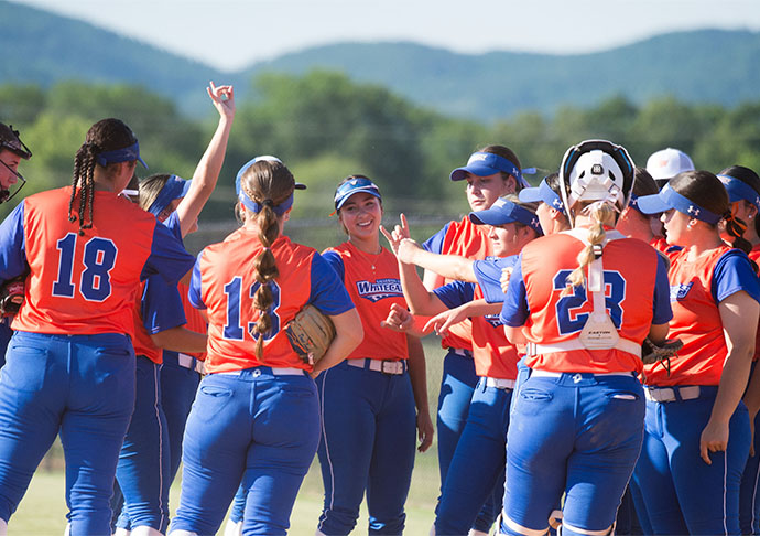 Softball team celebrates win together on field